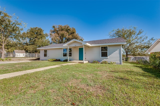 ranch-style house with a front lawn