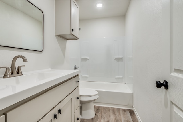 full bathroom with toilet, vanity, hardwood / wood-style floors, and  shower combination