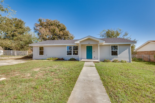 ranch-style home featuring a front yard