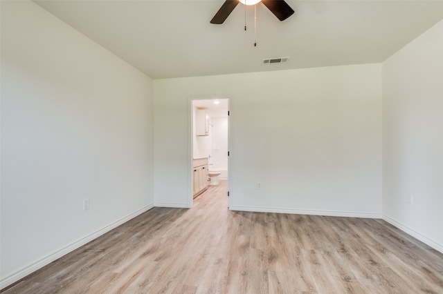 unfurnished room featuring light wood-type flooring and ceiling fan