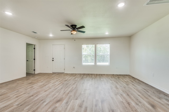 empty room featuring light hardwood / wood-style flooring and ceiling fan