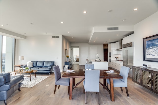 dining area featuring light wood-type flooring