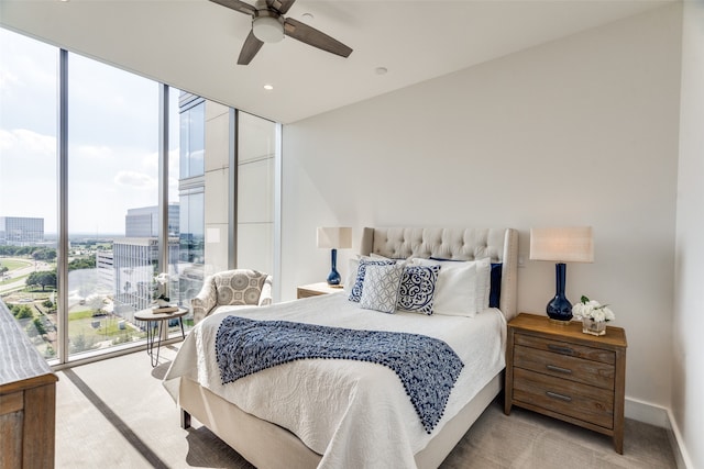 bedroom featuring light colored carpet and ceiling fan