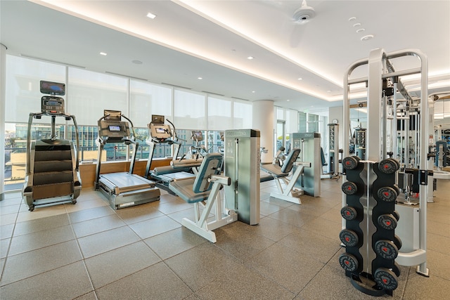 exercise room featuring floor to ceiling windows