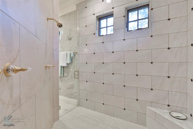 bathroom with a tile shower