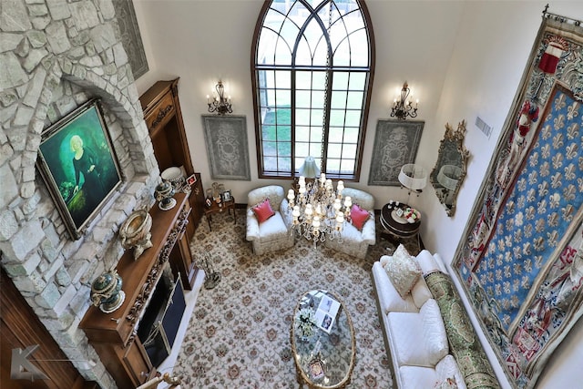 sitting room featuring a notable chandelier and a towering ceiling