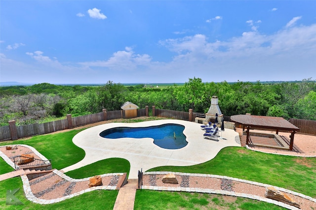 view of pool featuring a gazebo, a yard, a patio, and exterior fireplace