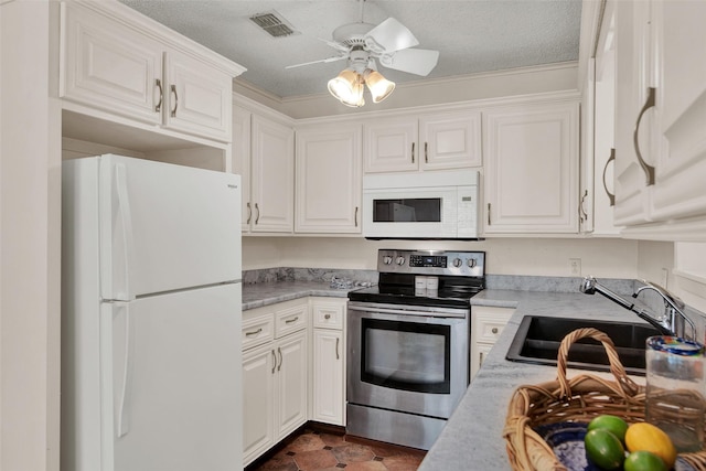 kitchen with white cabinetry, sink, and white appliances