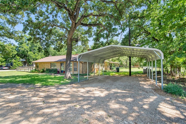 exterior space featuring a carport and a front lawn