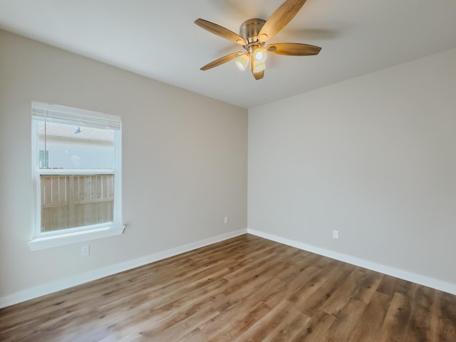 empty room featuring hardwood / wood-style floors and ceiling fan