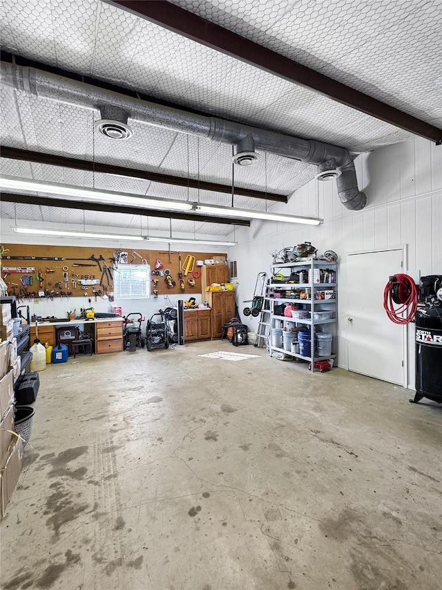 garage with a workshop area