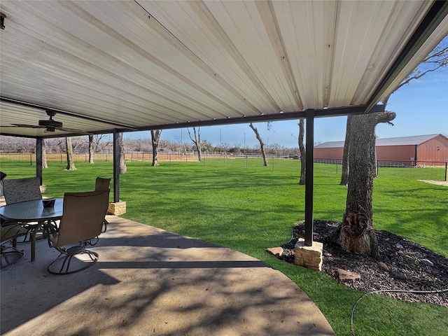 view of patio / terrace featuring a rural view and ceiling fan