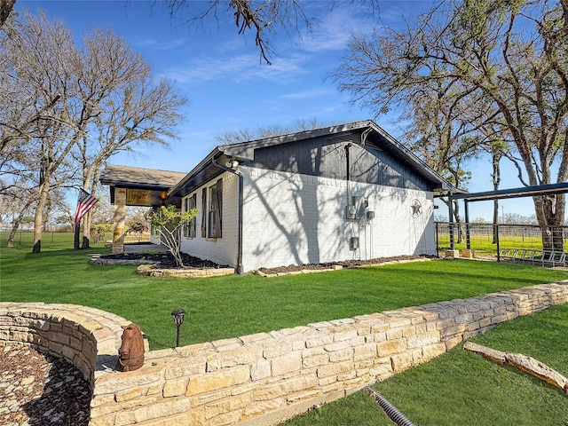 view of property exterior with a lawn