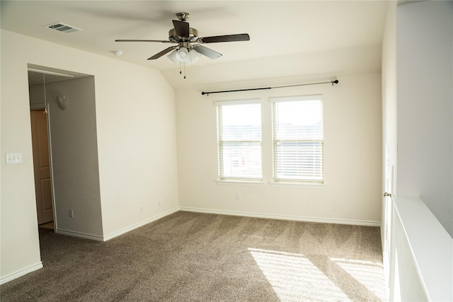 carpeted empty room featuring ceiling fan