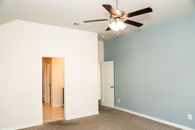 unfurnished bedroom with light colored carpet and ceiling fan