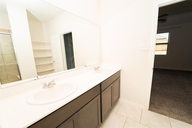 bathroom with tile patterned flooring and double sink vanity