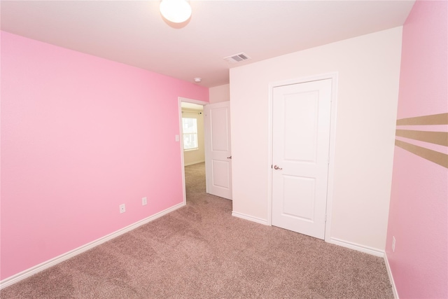 unfurnished bedroom with carpet floors