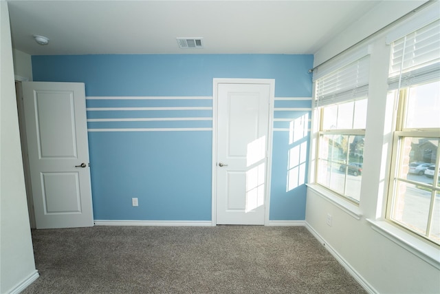 unfurnished bedroom featuring carpet flooring