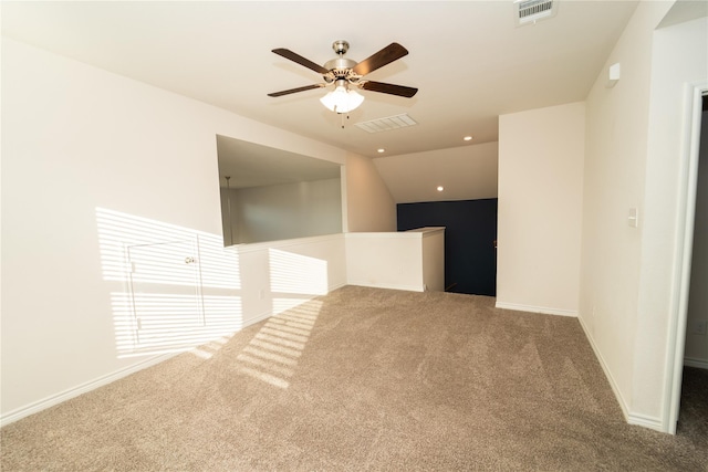 empty room featuring ceiling fan and carpet floors