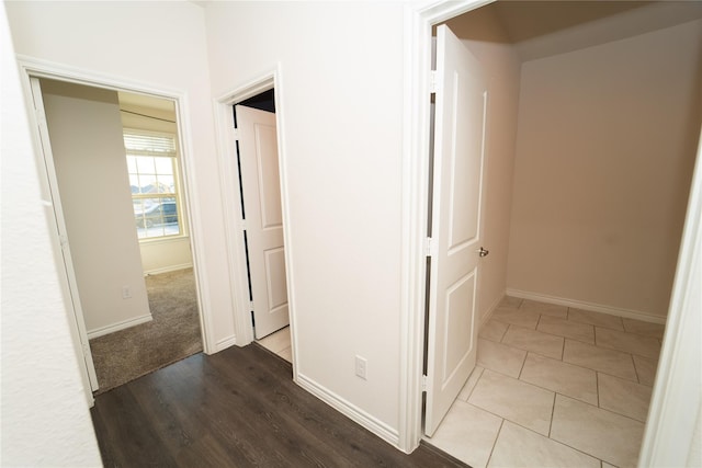 hallway with hardwood / wood-style floors