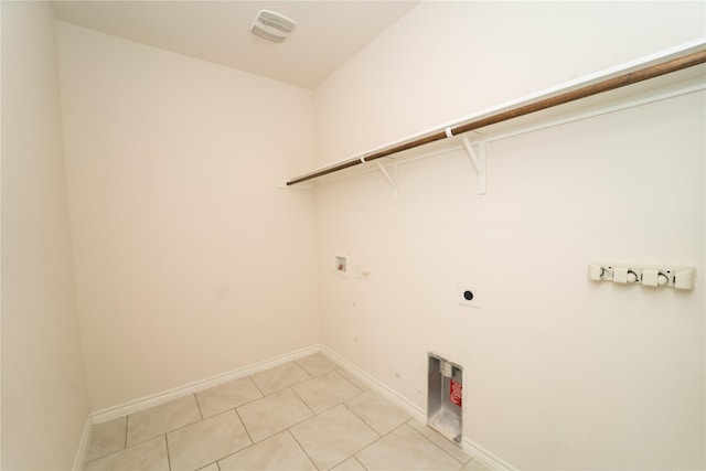 washroom with washer hookup, electric dryer hookup, and light tile patterned floors