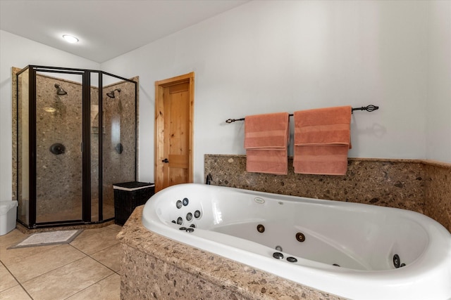 bathroom with tile patterned flooring, independent shower and bath, and lofted ceiling