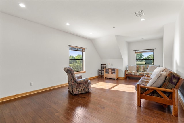 sitting room featuring hardwood / wood-style floors, vaulted ceiling, and a wealth of natural light