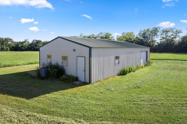 view of outbuilding featuring a yard and a garage