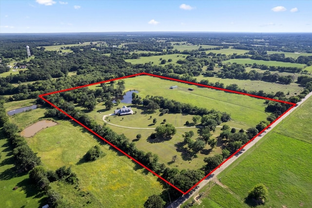 aerial view with a rural view and a water view