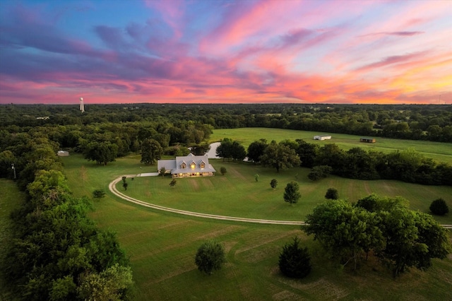 aerial view at dusk featuring a rural view