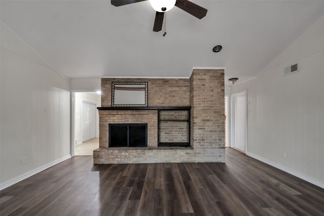 unfurnished living room featuring a fireplace, ceiling fan, dark hardwood / wood-style flooring, and vaulted ceiling