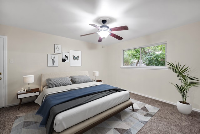 bedroom featuring ceiling fan and carpet