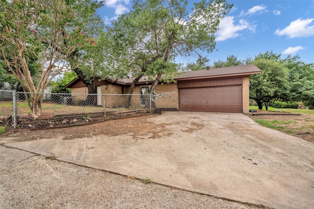 ranch-style home featuring a garage