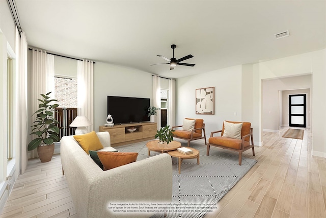 living room with ceiling fan, a healthy amount of sunlight, and light hardwood / wood-style flooring