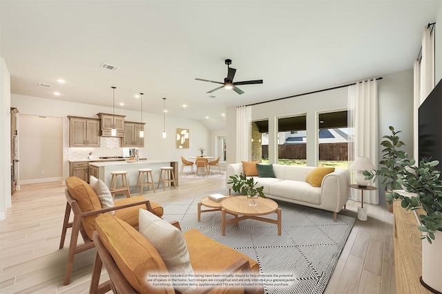 living room with ceiling fan and light hardwood / wood-style flooring