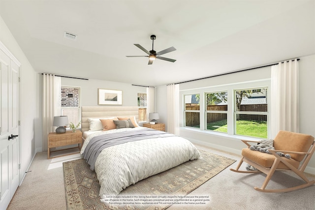 bedroom with light carpet and ceiling fan