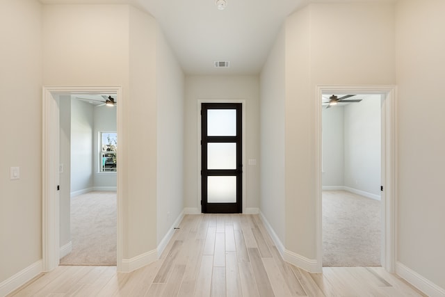 entrance foyer with light hardwood / wood-style flooring and ceiling fan