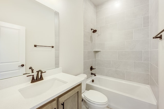 full bathroom featuring vanity, tiled shower / bath combo, and toilet