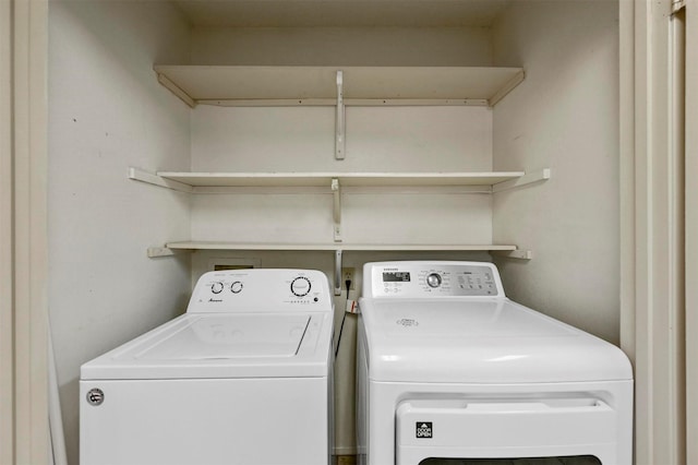 laundry room with washing machine and clothes dryer