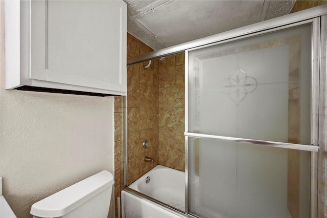 bathroom with toilet and enclosed tub / shower combo