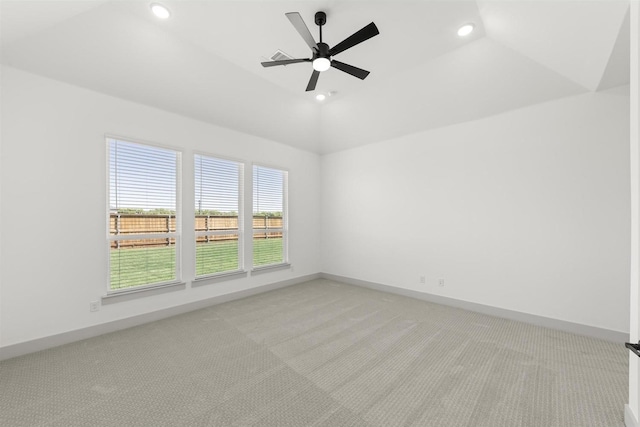 unfurnished room featuring lofted ceiling, light carpet, and ceiling fan