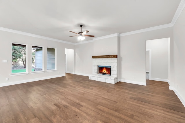 unfurnished living room with ceiling fan, wood-type flooring, and ornamental molding