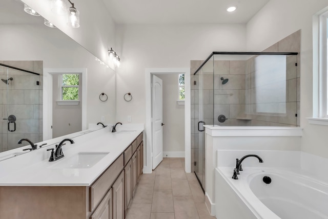 bathroom featuring vanity, tile patterned floors, and shower with separate bathtub