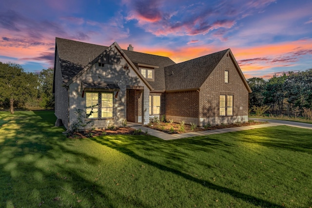 view of front of home with a yard