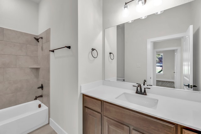 bathroom featuring vanity and tiled shower / bath combo