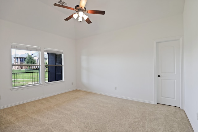 carpeted spare room with ceiling fan