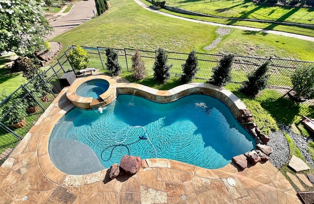 view of swimming pool with an in ground hot tub and a lawn