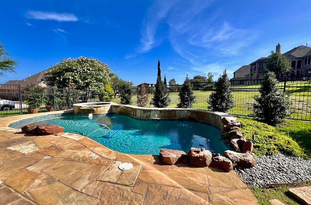 view of pool featuring an in ground hot tub