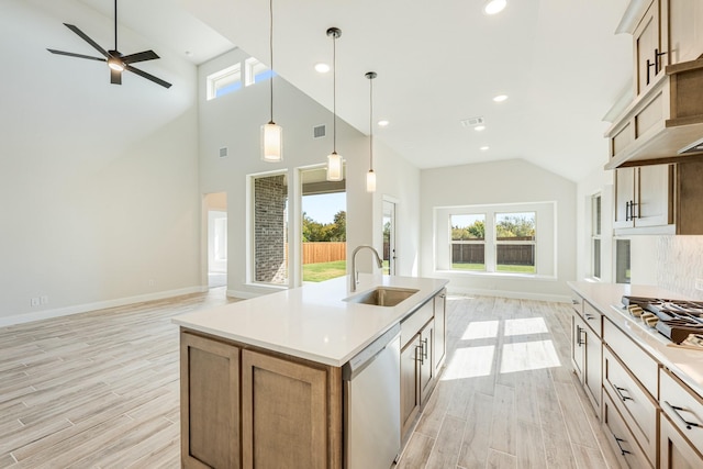 3412 Running Stream Way, Melissa, TX 75454 - kitchen with a sink, dishwashing machine, light wood-style floors, baseboards, and open floor plan