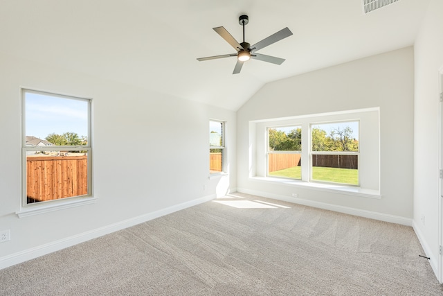 unfurnished room with carpet floors, ceiling fan, and vaulted ceiling